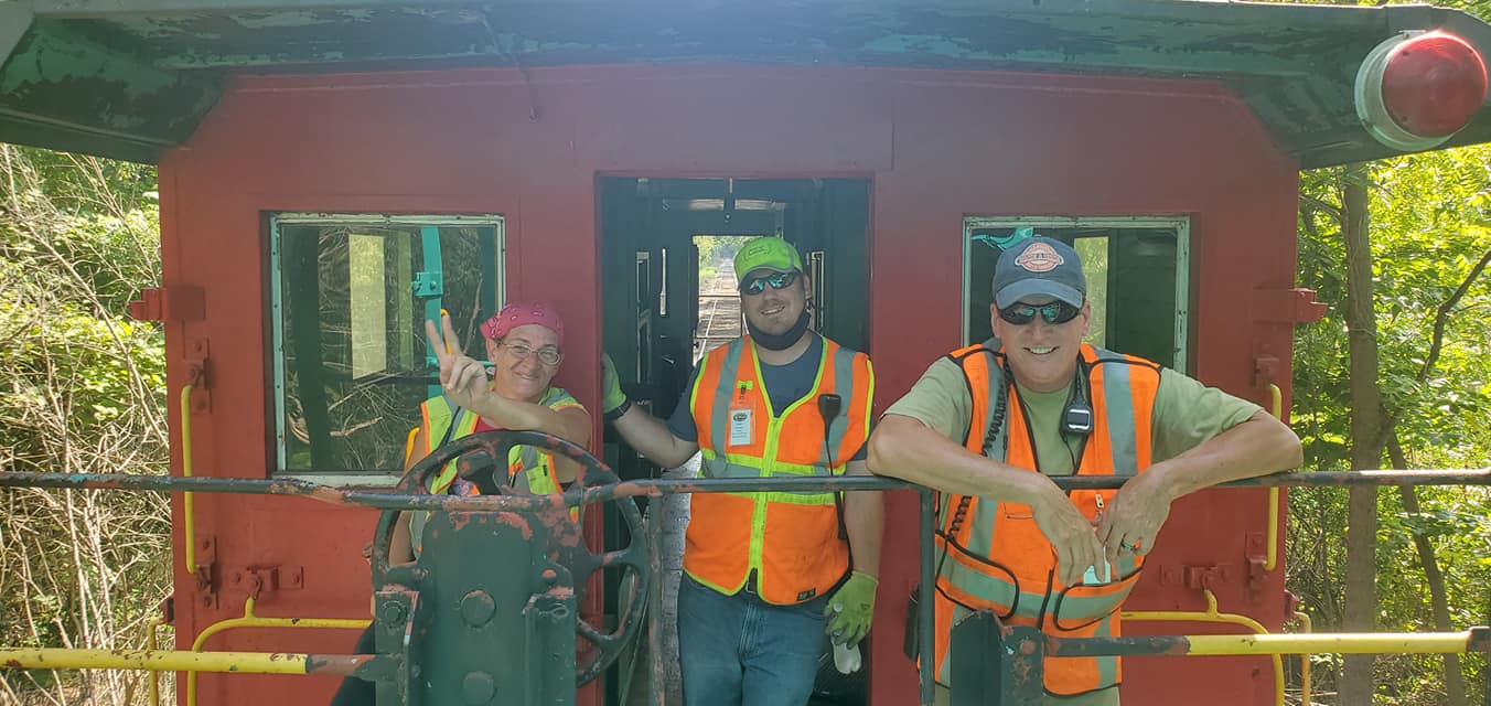 Crew members on the cupola caboose